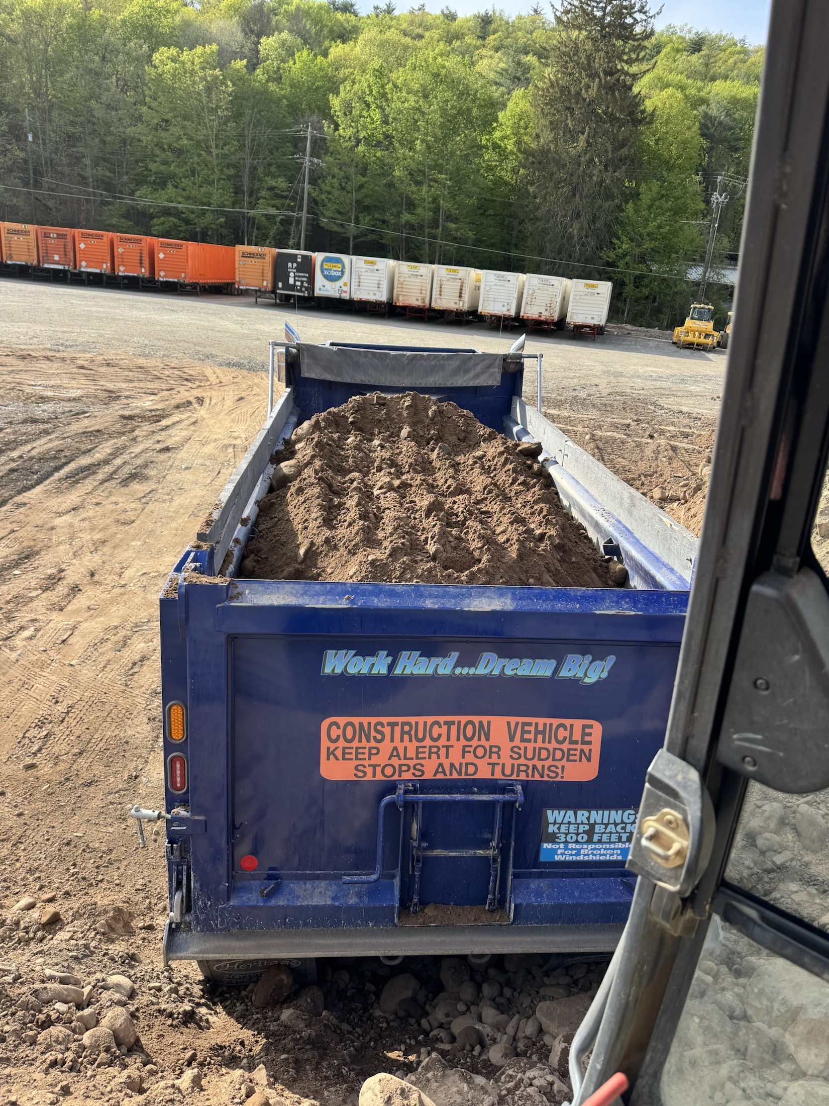 Fill dirt loaded in the rear of a dump truck